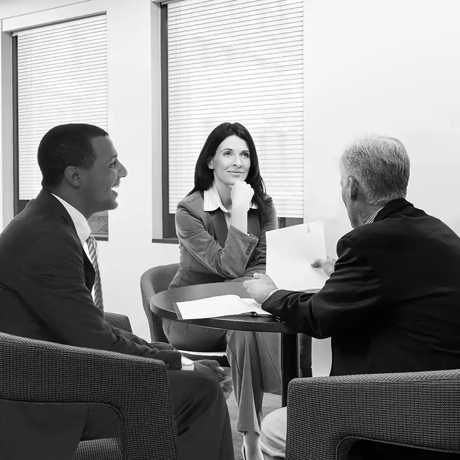 Woodstock portfolio manager Ben Dawson meeting with clients in his office
